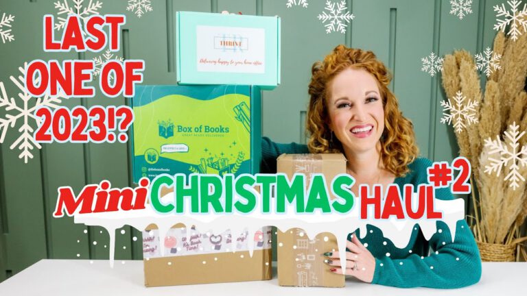 Smiling curly-haired woman at a table with wrapped gifts and Christmas decor, thumbnail text reading mini Christmas haul